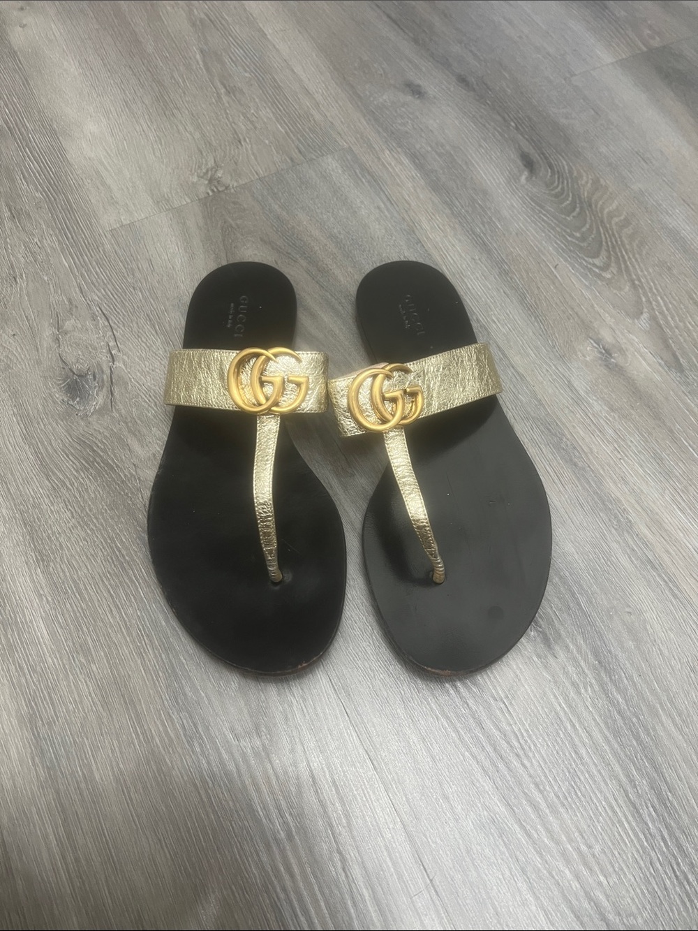 Gucci Metallic Gold Leather Thong Sandals with Black Footbed
